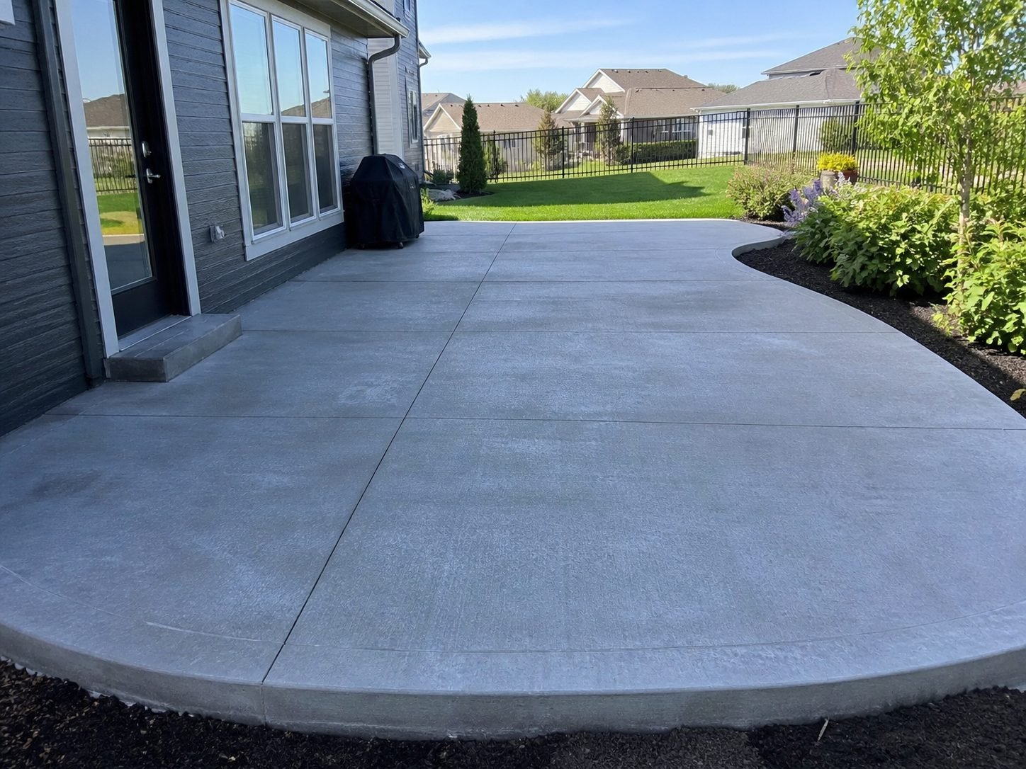 Concrete patio installation in Raytown area backyard